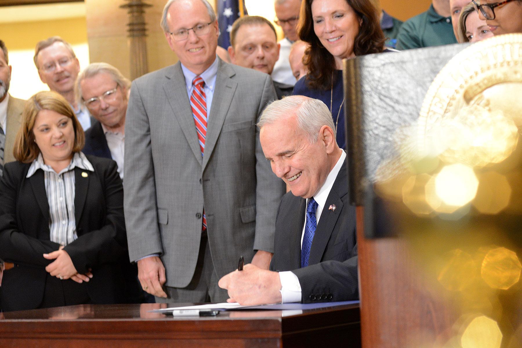Governor Dayton makes history by signing the 2018 Omnibus Pension Bill into law